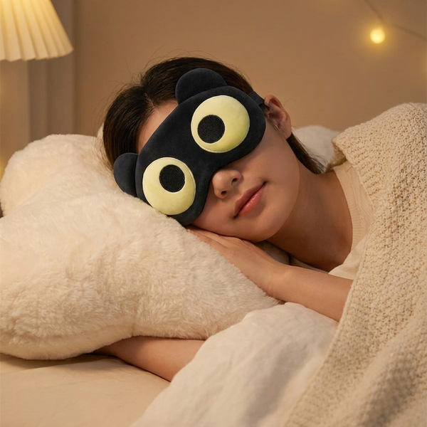 Bear plush sleep mask worn in bed
